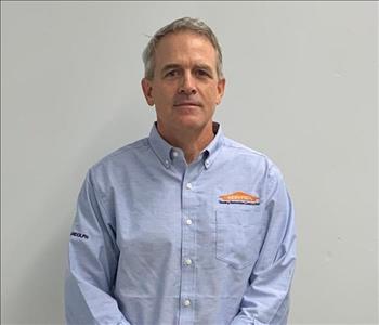 male portrait in blue servpro shirt