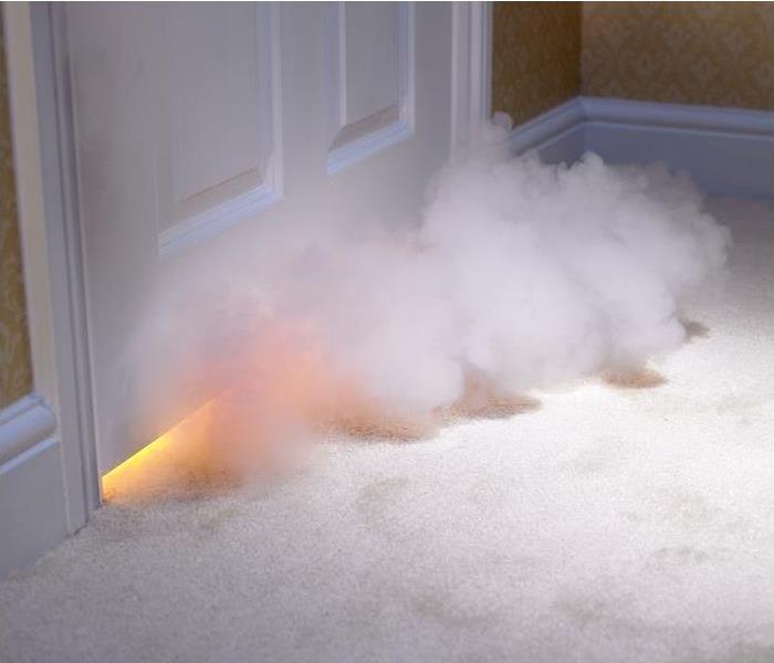 smoke entering room from under door; blaze seen from under door