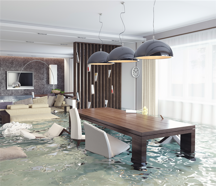 flooded dining room with table and chairs