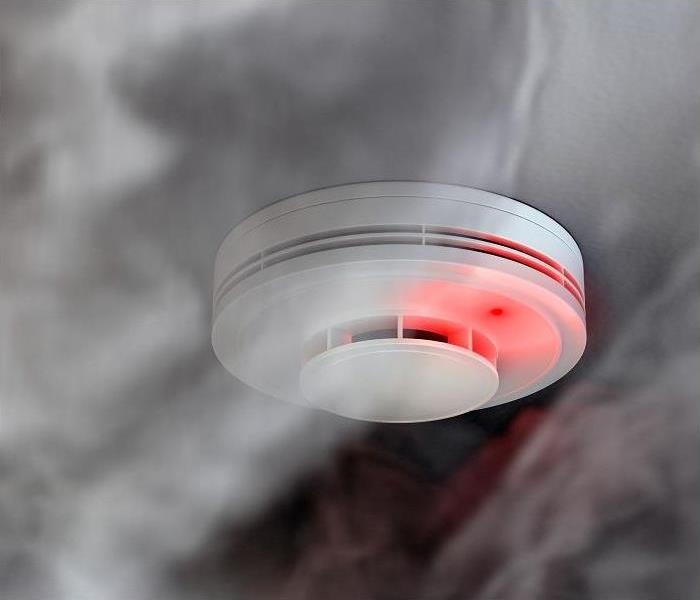 smoke detector becoming surrounded by smoke